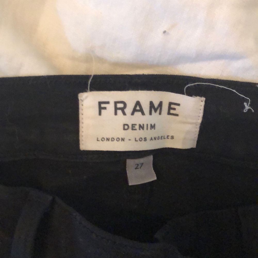 Black ripped frame jeans
